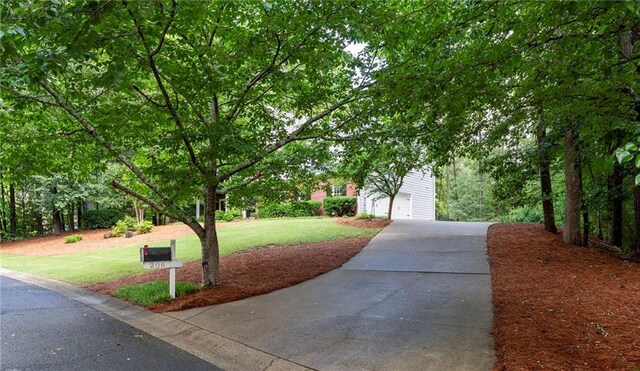 206 Kingsley Way, Woodstock, GA 30188 - surrounding community featuring driveway, a lawn, and a garage