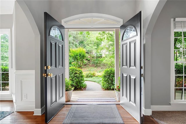 206 Kingsley Way, Woodstock, GA 30188 - entryway with arched walkways, healthy amount of natural light, and wood finished floors