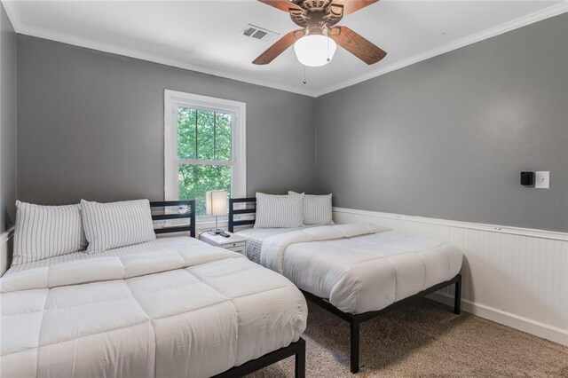 1123 Seaboard Ave NW, Atlanta, GA 30318 - carpeted bedroom with ornamental molding, visible vents, ceiling fan, and wainscoting