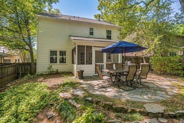 1123 Seaboard Ave NW, Atlanta, GA 30318 - back of house with a patio, a sunroom, and a fenced backyard