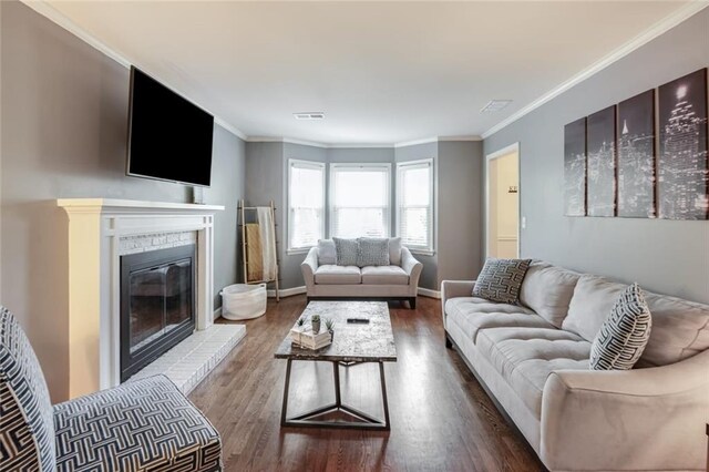 1123 Seaboard Ave NW, Atlanta, GA 30318 - living area featuring wood finished floors, crown molding, baseboards, and visible vents