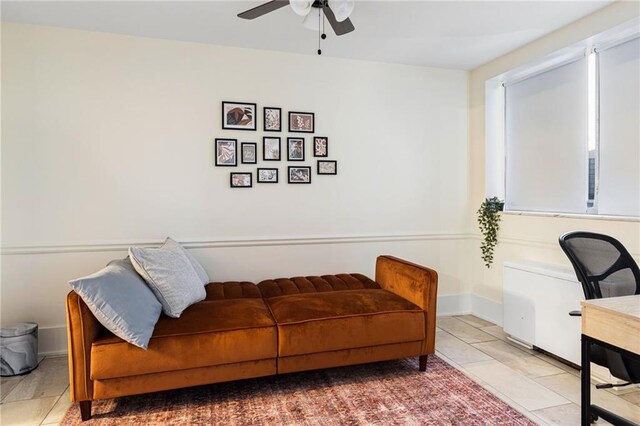 living area featuring ceiling fan