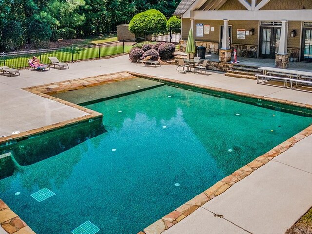 view of swimming pool featuring a patio