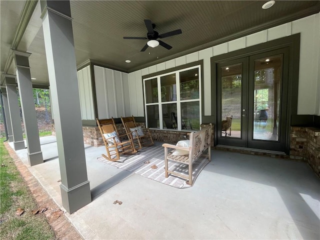 view of patio featuring french doors, ceiling fan, and a porch