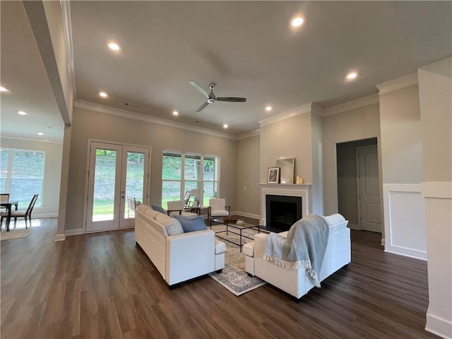 living room with ceiling fan, crown molding, and dark hardwood / wood-style flooring