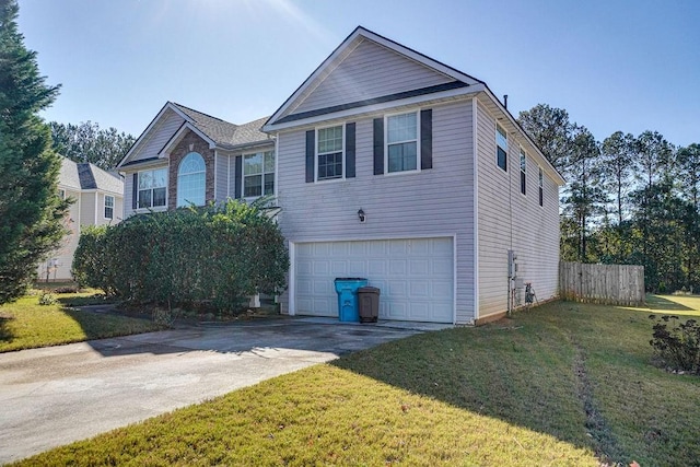 view of front facade with a front yard and a garage