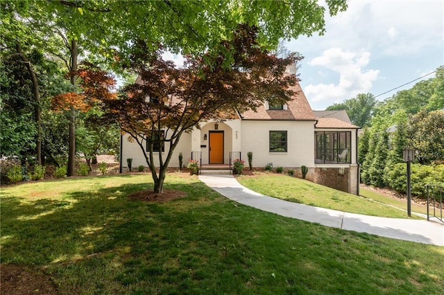 view of front of property with a front lawn