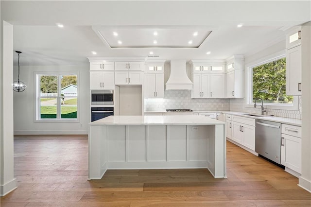 4815 Price Rd, Gainesville, GA 30506 - kitchen featuring custom range hood, appliances with stainless steel finishes, a kitchen island, light countertops, and recessed lighting