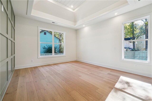 4815 Price Rd, Gainesville, GA 30506 - unfurnished room with light wood-style flooring, healthy amount of natural light, a raised ceiling, and recessed lighting