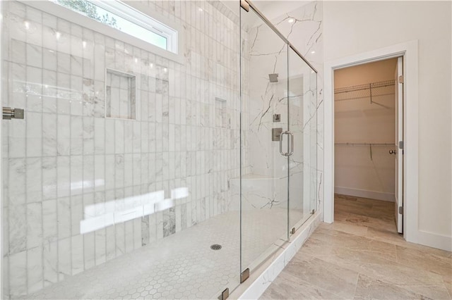 4815 Price Rd, Gainesville, GA 30506 - bathroom featuring a marble finish shower and a walk in closet