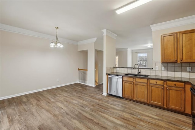 kitchen with a sink, backsplash, brown cabinets, and stainless steel dishwasher