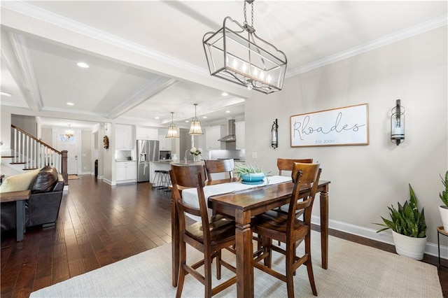 dining space featuring recessed lighting, dark wood-style flooring, baseboards, ornamental molding, and an inviting chandelier