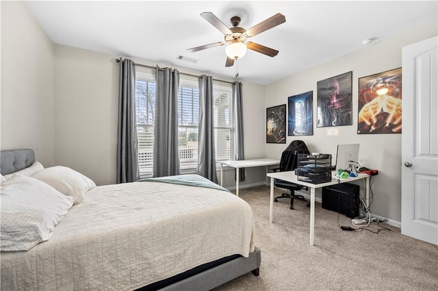 bedroom with a ceiling fan, baseboards, visible vents, and carpet flooring