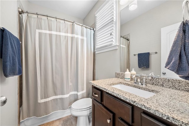 full bathroom with shower / tub combo, vanity, and toilet