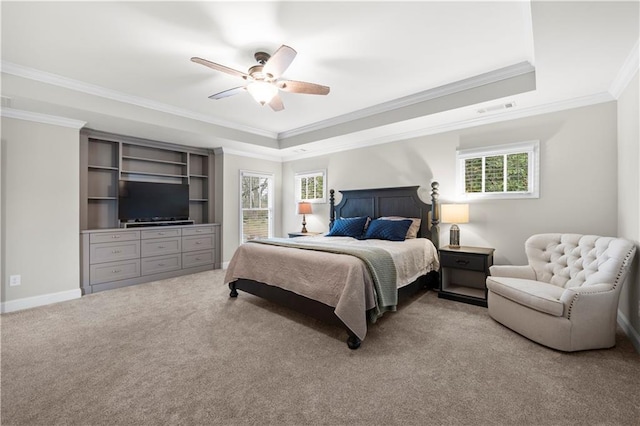 bedroom with baseboards, visible vents, a raised ceiling, a ceiling fan, and light colored carpet