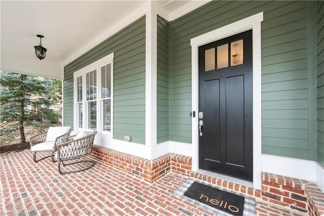 doorway to property with a porch