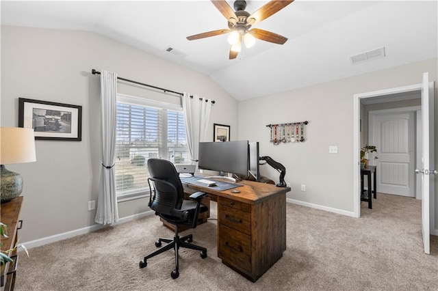 home office with lofted ceiling, baseboards, visible vents, and carpet flooring