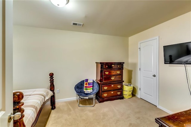 interior space with carpet floors, visible vents, and baseboards