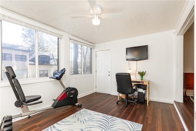 office area with ceiling fan, dark hardwood / wood-style flooring, and a textured ceiling