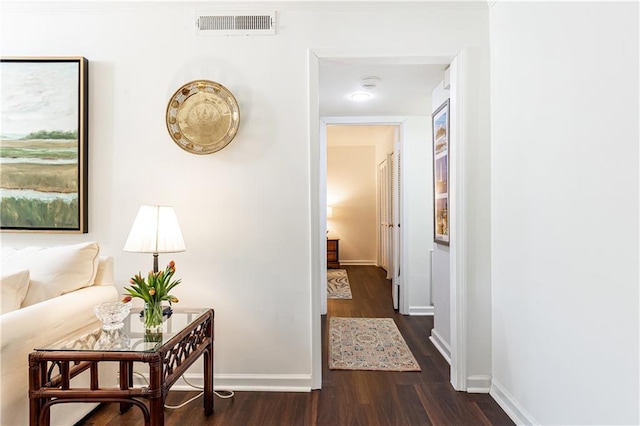 corridor featuring dark hardwood / wood-style flooring