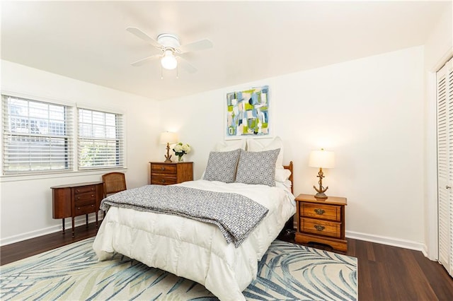 bedroom featuring a closet, dark hardwood / wood-style flooring, and ceiling fan