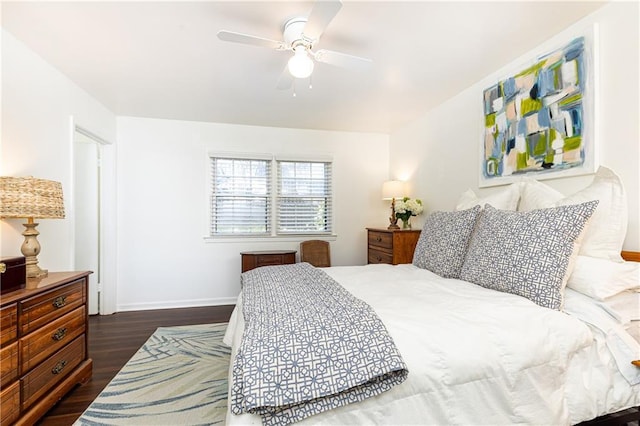 bedroom featuring ceiling fan and dark hardwood / wood-style flooring