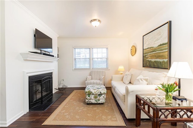 living room with dark wood-type flooring and ornamental molding