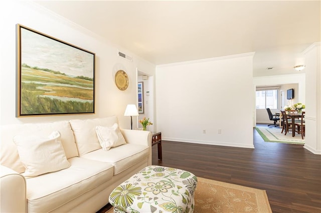 living room with dark hardwood / wood-style floors and crown molding