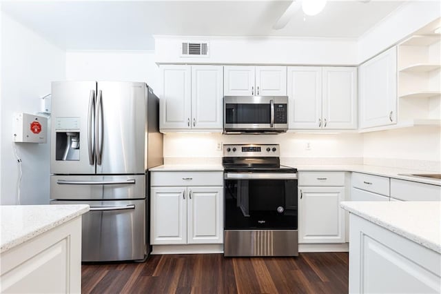 kitchen with ceiling fan, appliances with stainless steel finishes, dark hardwood / wood-style flooring, and white cabinetry