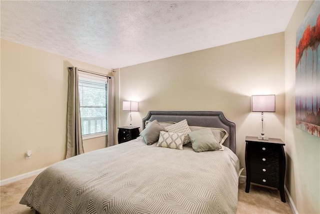 carpeted bedroom with a textured ceiling