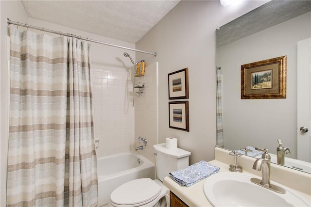 full bathroom featuring vanity, shower / tub combo, a textured ceiling, and toilet