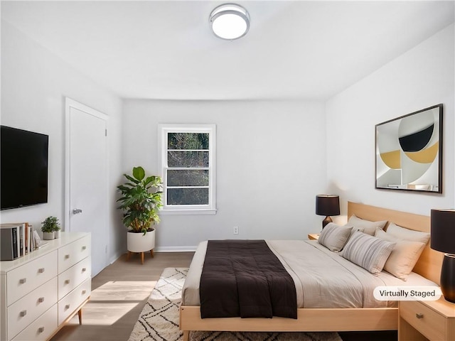 bedroom featuring light wood-type flooring