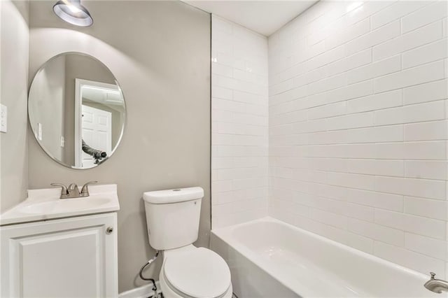 full bathroom featuring washtub / shower combination, vanity, and toilet