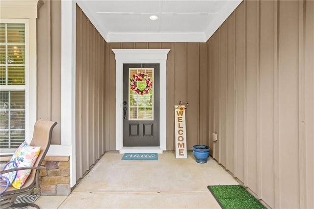 doorway to property featuring board and batten siding