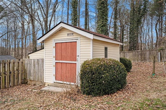 view of shed with fence