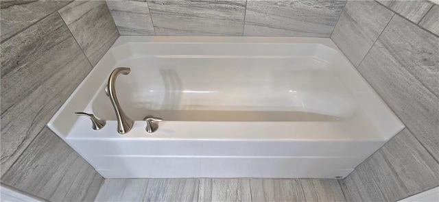 full bathroom with wood finished floors and a tub to relax in