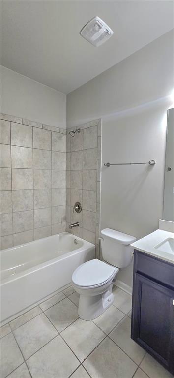 full bath with toilet, visible vents, tile patterned flooring, and vanity