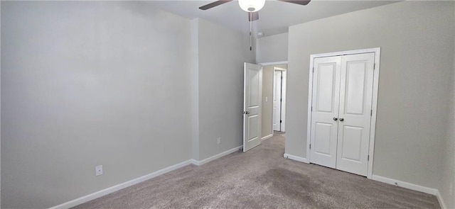 unfurnished bedroom featuring a ceiling fan, baseboards, a closet, and carpet