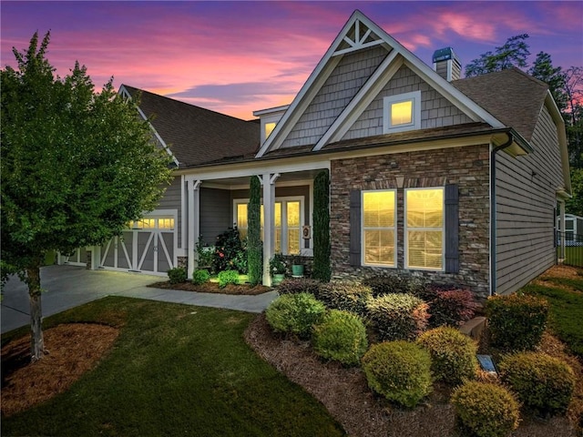 105 Laurel Canyon Trl, Canton, GA 30114 - view of front facade featuring stone siding, a chimney, a garage, and a front lawn