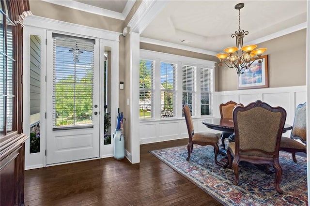 105 Laurel Canyon Trl, Canton, GA 30114 - dining area with a chandelier, a decorative wall, dark wood-style flooring, a tray ceiling, and a wainscoted wall