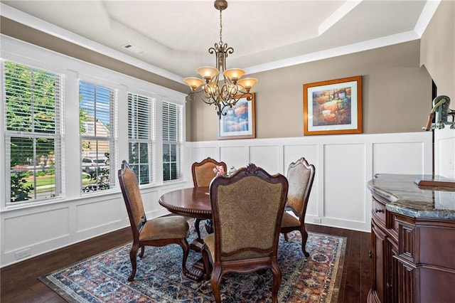 105 Laurel Canyon Trl, Canton, GA 30114 - dining room featuring a raised ceiling, a decorative wall, a chandelier, dark wood-style floors, and plenty of natural light