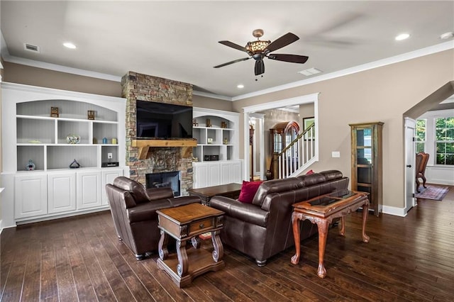 105 Laurel Canyon Trl, Canton, GA 30114 - living room with ceiling fan, dark wood-type flooring, crown molding, stairs, and a stone fireplace