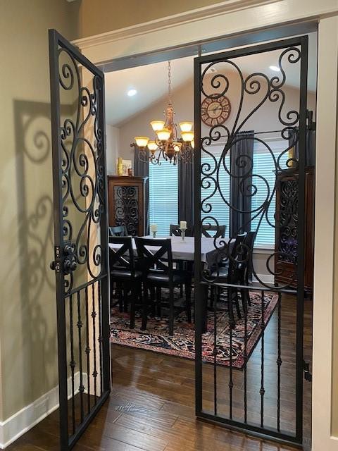 105 Laurel Canyon Trl, Canton, GA 30114 - dining room with a chandelier, wood finished floors, and lofted ceiling