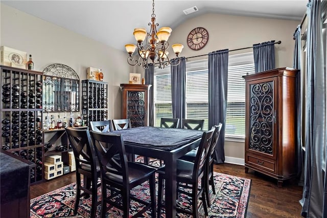 105 Laurel Canyon Trl, Canton, GA 30114 - dining room featuring a chandelier, lofted ceiling, and dark wood-style flooring