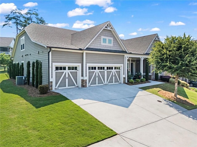 105 Laurel Canyon Trl, Canton, GA 30114 - craftsman inspired home featuring concrete driveway, a front lawn, a shingled roof, an attached garage, and stone siding