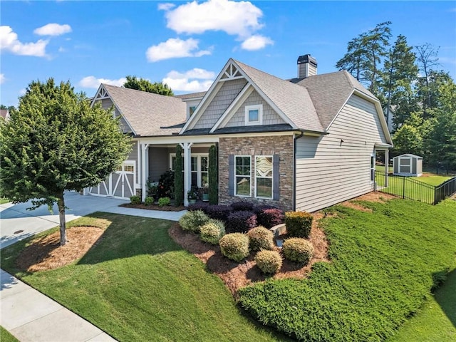 105 Laurel Canyon Trl, Canton, GA 30114 - craftsman house with stone siding, a storage unit, roof with shingles, a chimney, and driveway