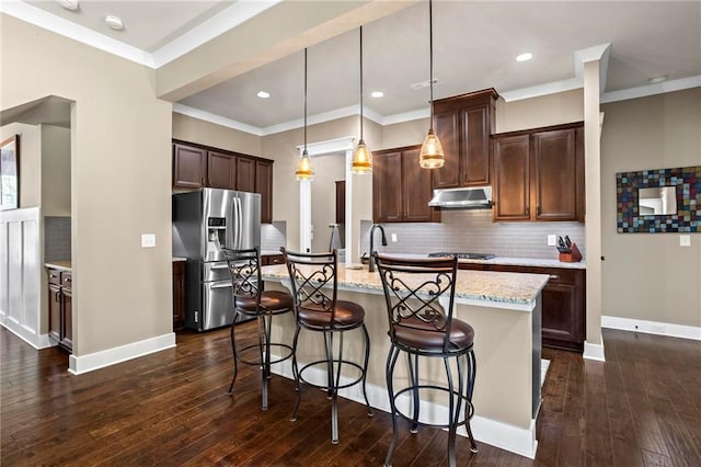 105 Laurel Canyon Trl, Canton, GA 30114 - kitchen with stainless steel refrigerator with ice dispenser, an island with sink, tasteful backsplash, a breakfast bar area, and crown molding