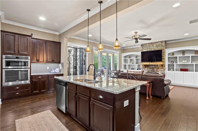 105 Laurel Canyon Trl, Canton, GA 30114 - kitchen with appliances with stainless steel finishes, a ceiling fan, dark wood-style flooring, light stone counters, and ornamental molding