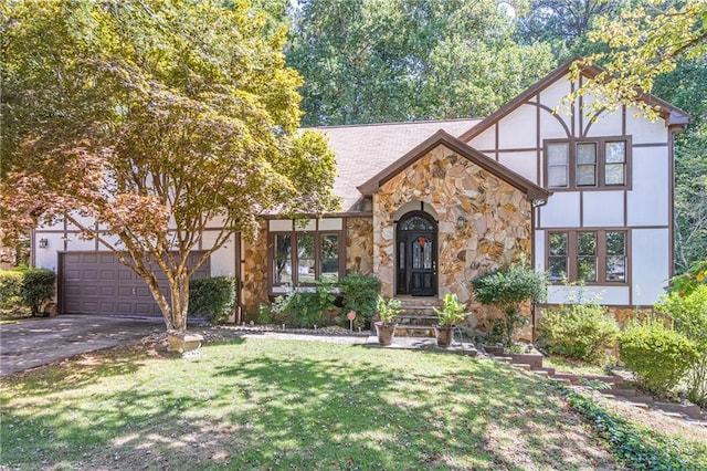 tudor house featuring a garage