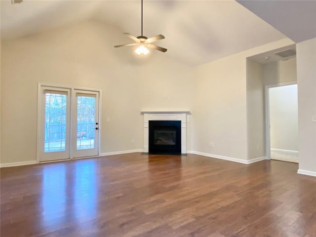 unfurnished living room featuring visible vents, a fireplace with flush hearth, baseboards, ceiling fan, and dark wood-style flooring